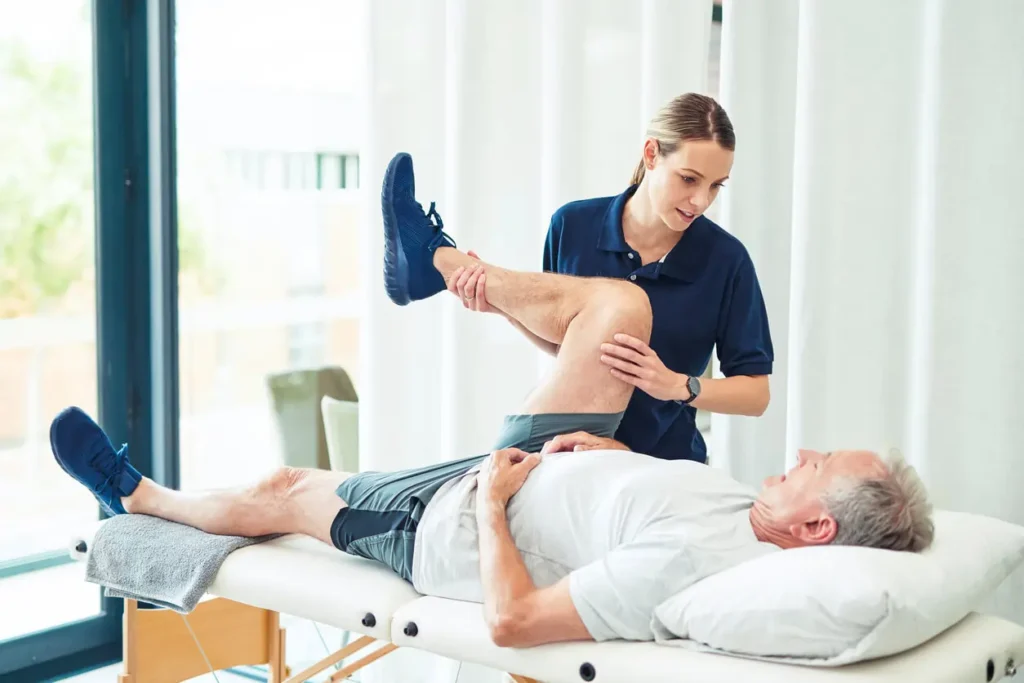 Revitalising Recovery: Effective Rehabilitation Strategies for Muscle Injuries 3 Physiotherapist assisting a patient with muscle recovery exercises Melton Mowbray