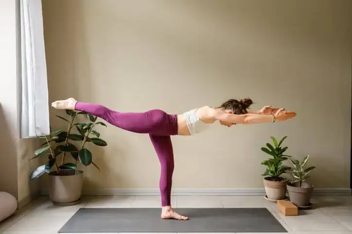 Woman doing Yoga exercise Melton Mowbray to help with toning the body. 