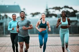 Sculpting Sleek Arms: The Essential Role of Cardio in Toning Without Bulking Up 3 image of people running to incorporate cardio Melton Mowbray exercise into their life to help tone arms and body.