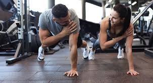 Sculpting Sleek Arms: The Essential Role of Cardio in Toning Without Bulking Up 1 Image of man and woman doing Cardio Melton Mowbray to tone their arms.